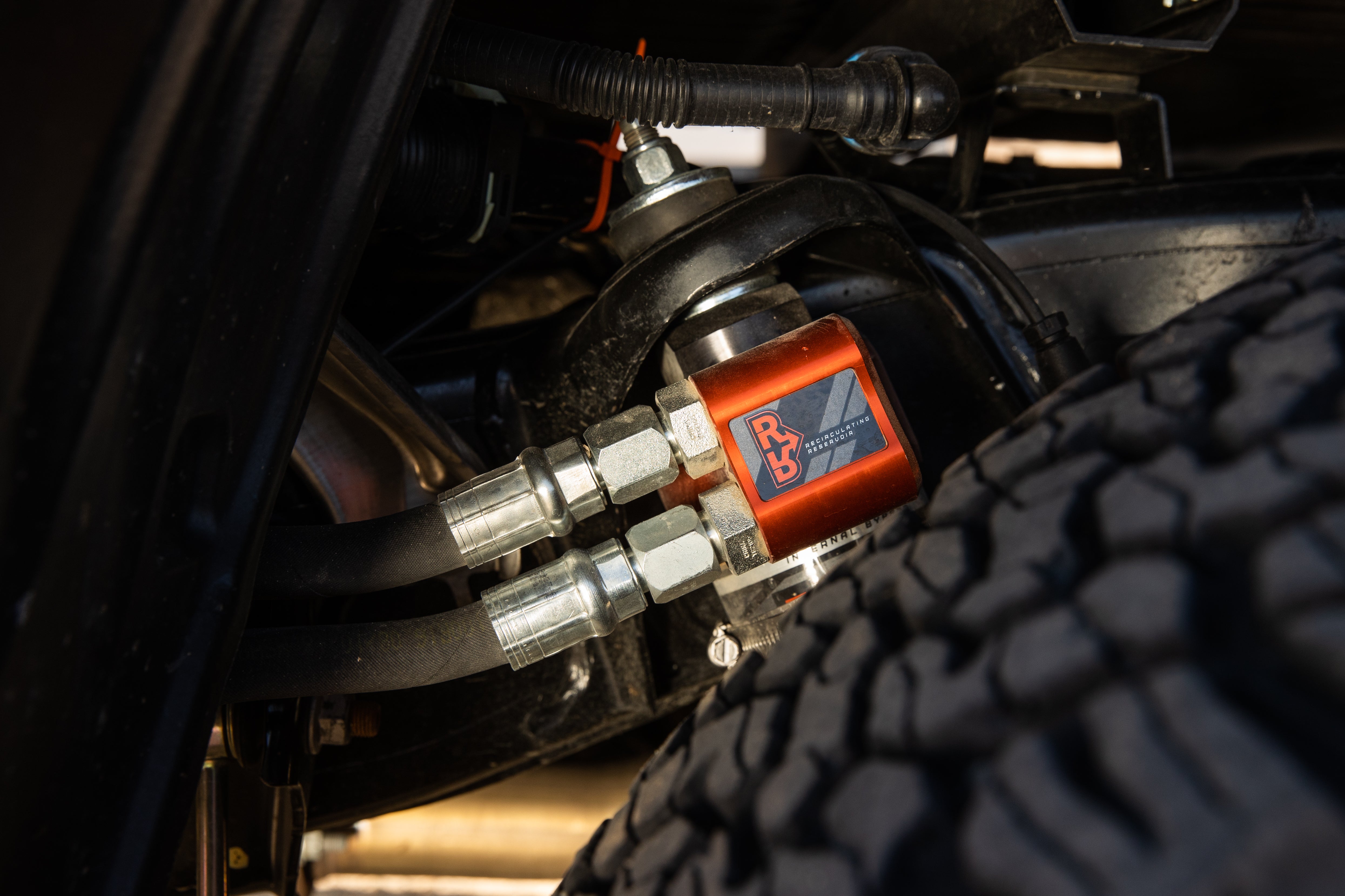 '22-24 Toyota Tundra FOX 3.0 FACTORY RACE RR Coilovers & Rear Shocks (1-2" Lift) w/ Upper Arms & Trailing Arm Combo Kit Close-up Display on Vehicle