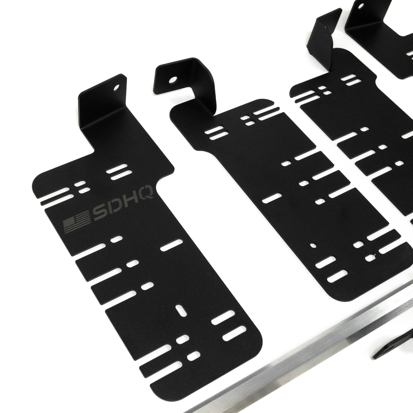 SDHQ Built '21-25 F150 / Raptor Behind the Grille Light Mounting Kit display of included parts and hardware