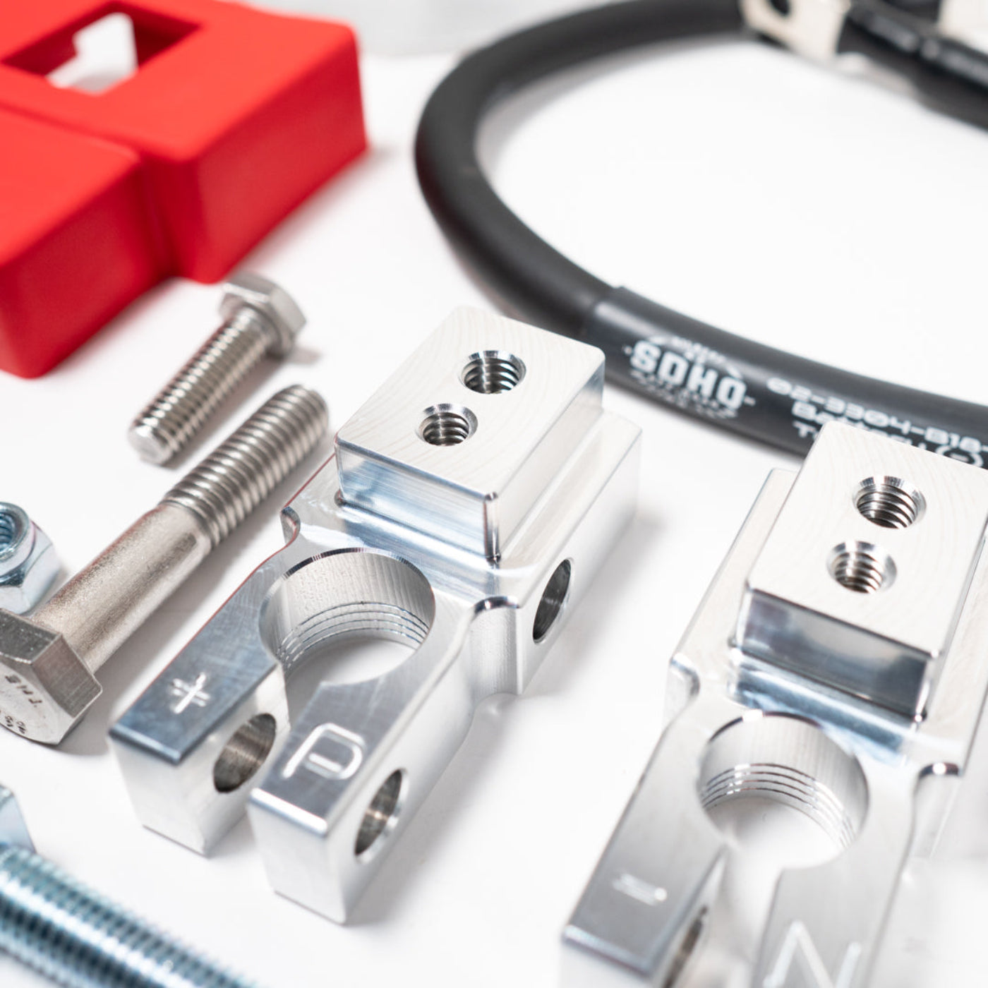 '19-24 RAM 2500/3500 Complete Billet Battery Terminal and Distribution Kit display of included parts and hardware