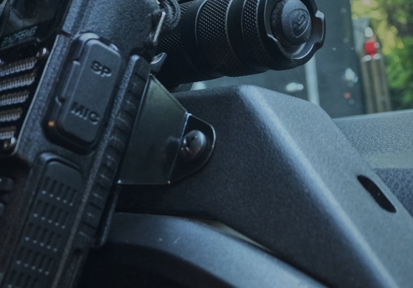 CB Mic and Handheld Radio Holder Close-up Display in Vehicle