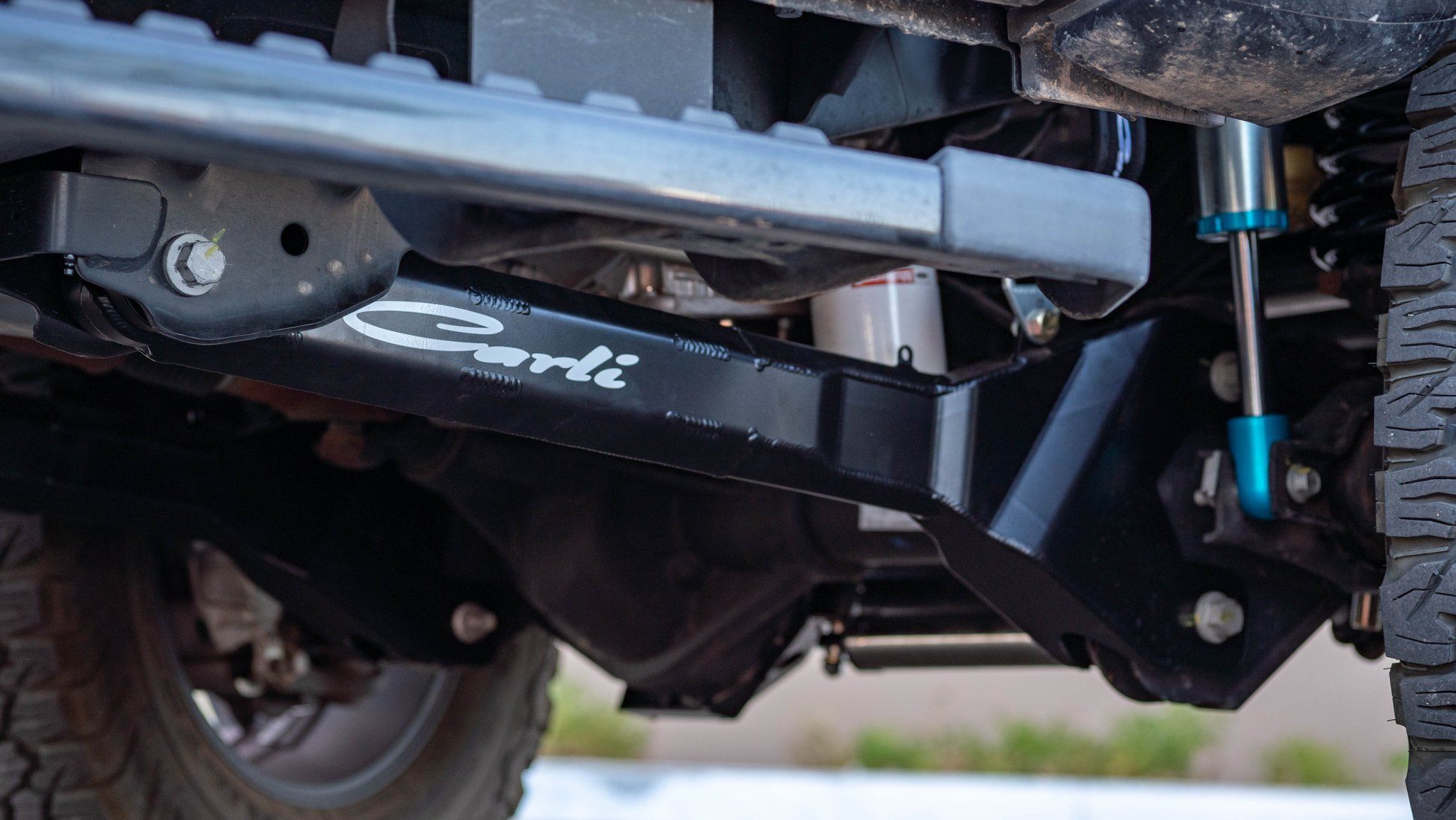 2023-2024 Ford F250/350 Carli Suspension Fabricated Radius Arms for 3.5" Lift Close-up Display on Vehicle 