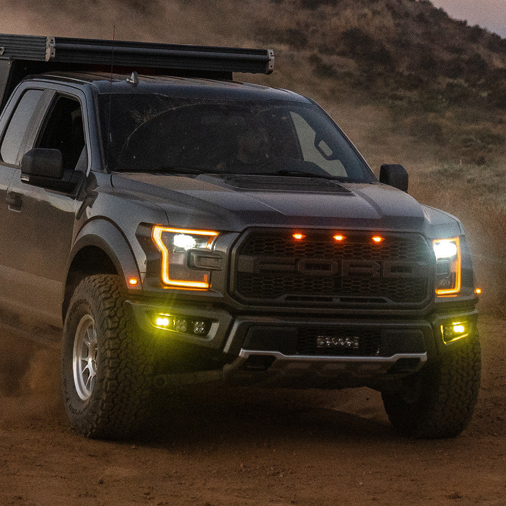 17-20 Ford Raptor Squadron/S2 SAE “Pro” Fog Pocket Light Kit Amber display on Vehicle (In Use)