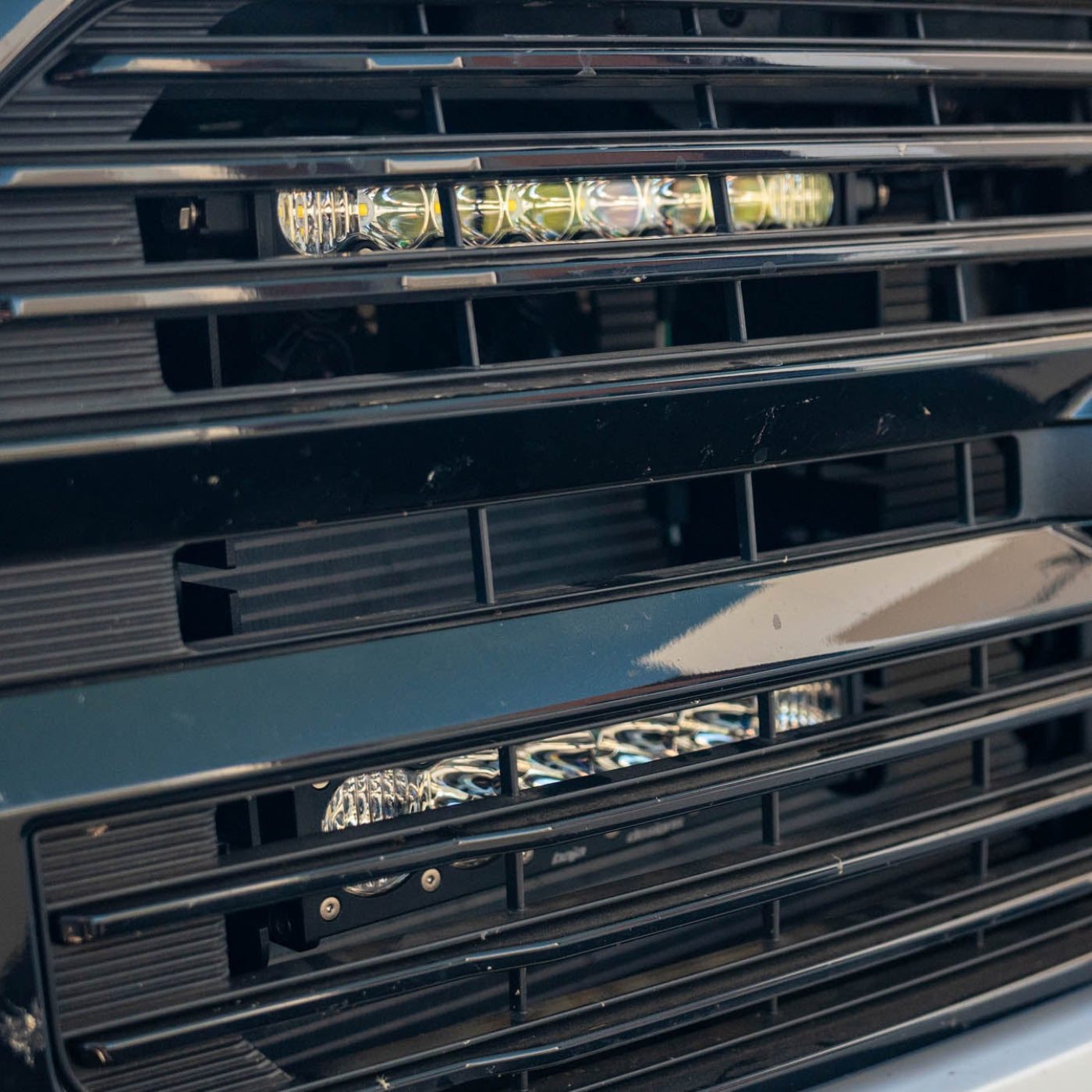 SDHQ Built '21-25 F150 / Raptor Behind the Grille Light Mounting Kit installed close-up 