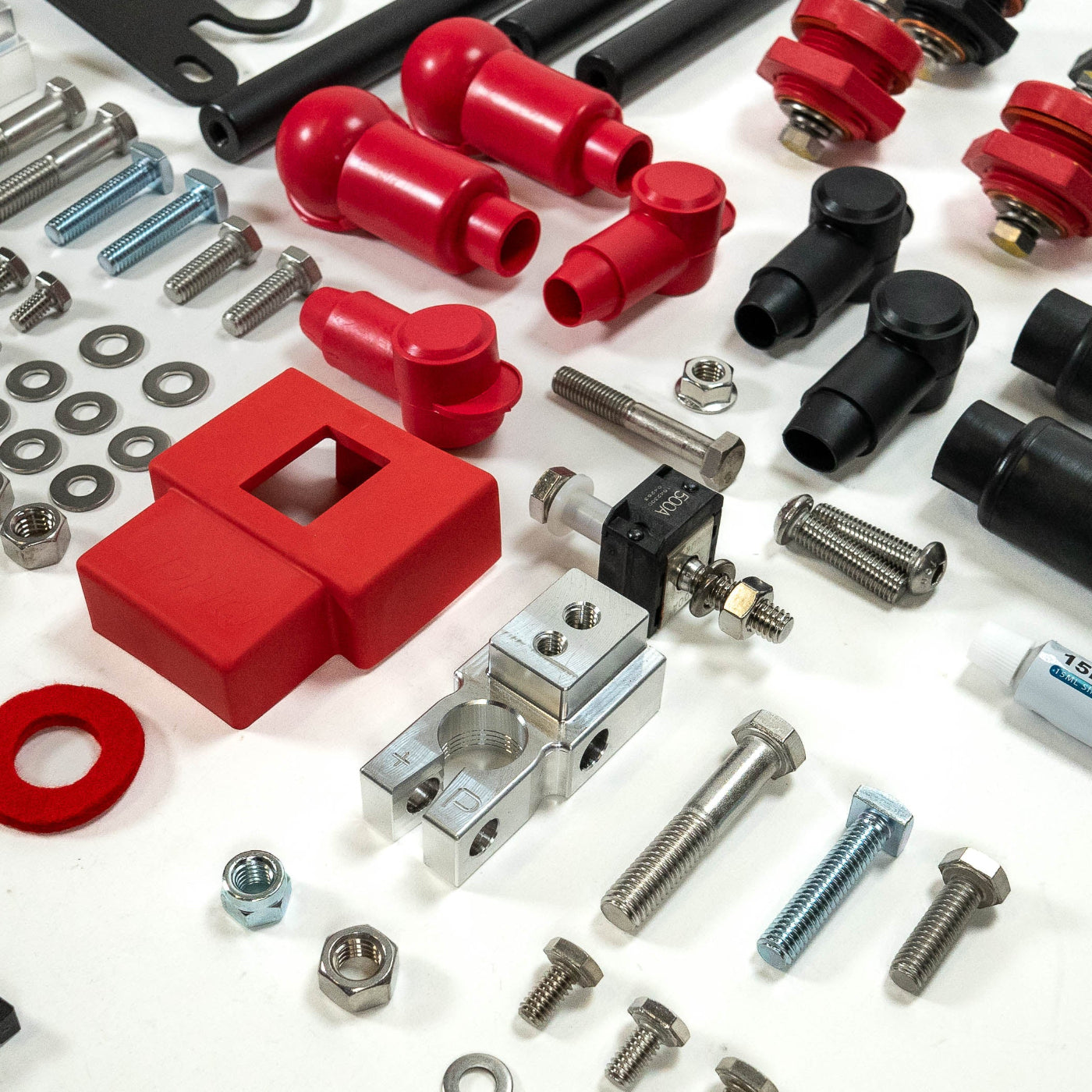 '24+ LC250 SDHQ Built Under Hood Power Solution Kit display of included parts and hardware - close-up