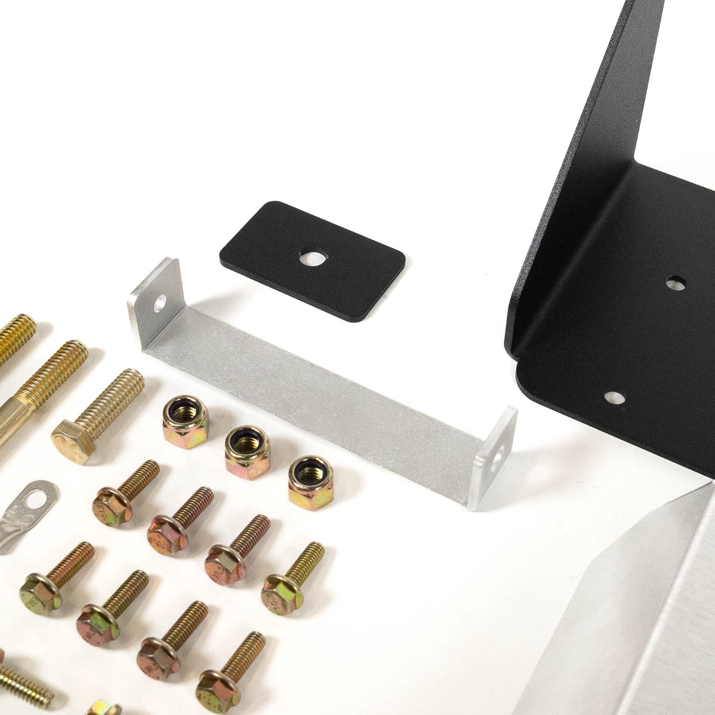 SDHQ Built 2025 4Runner ARB Twin Air Compressor Mount display of included parts and hardware - close-up 