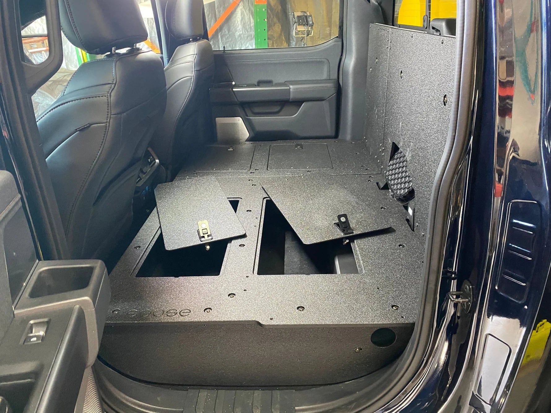 Ford - F150 2021-Present - 14th Gen. SuperCrew - Second Row Seat Delete Plate System with Factory B&O Subwoofer Center Wall with Exterior Port Front View