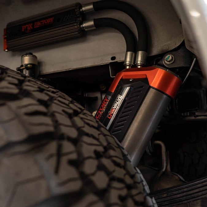 '19-20 Ford Raptor Fox Factory Race Series 3.0 Live Valve Internal Bypass Coilovers & PB Rear Shock Package Close-up Display on Vehicle 