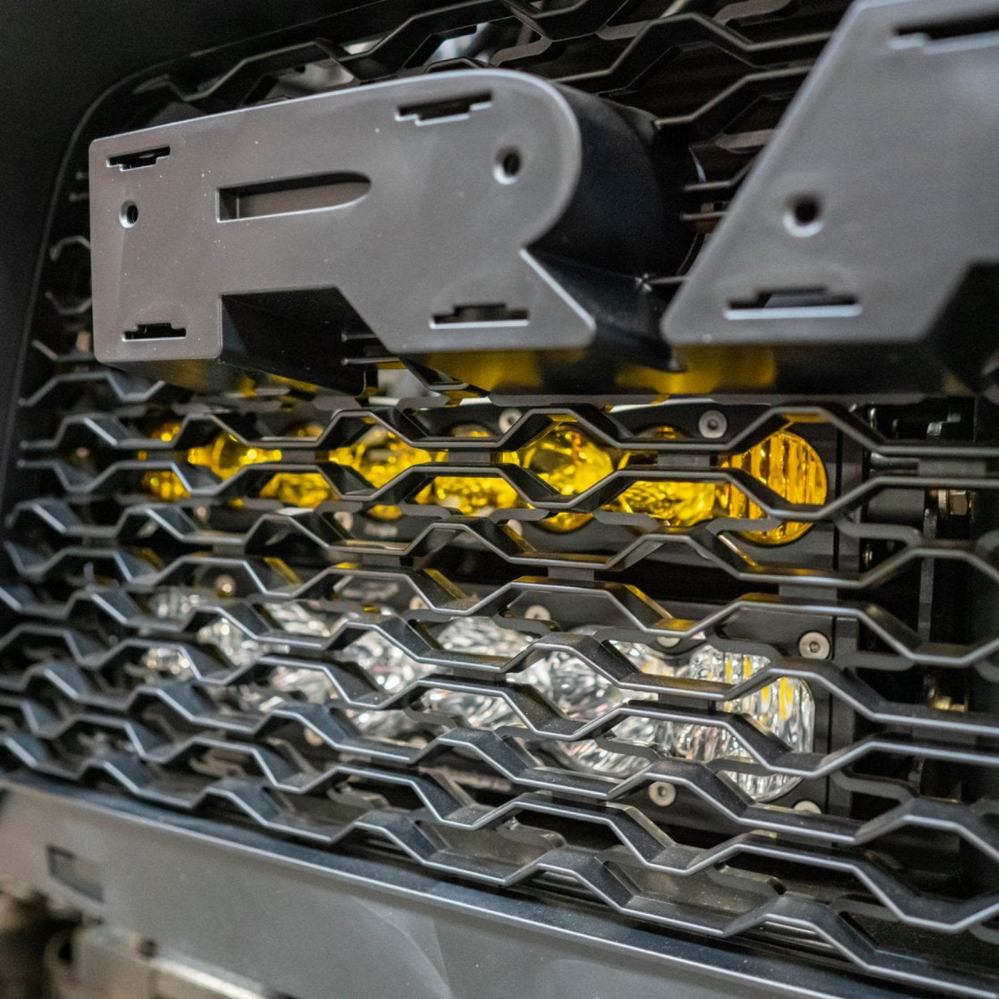 2025 Ram 1500 RHO SDHQ Built Behind the Grille LED Light Bar Mount installed 