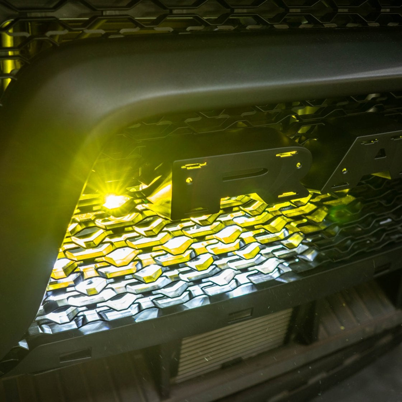 2025 Ram 1500 RHO SDHQ Built Behind the Grille LED Light Bar Mount installed - close-up 