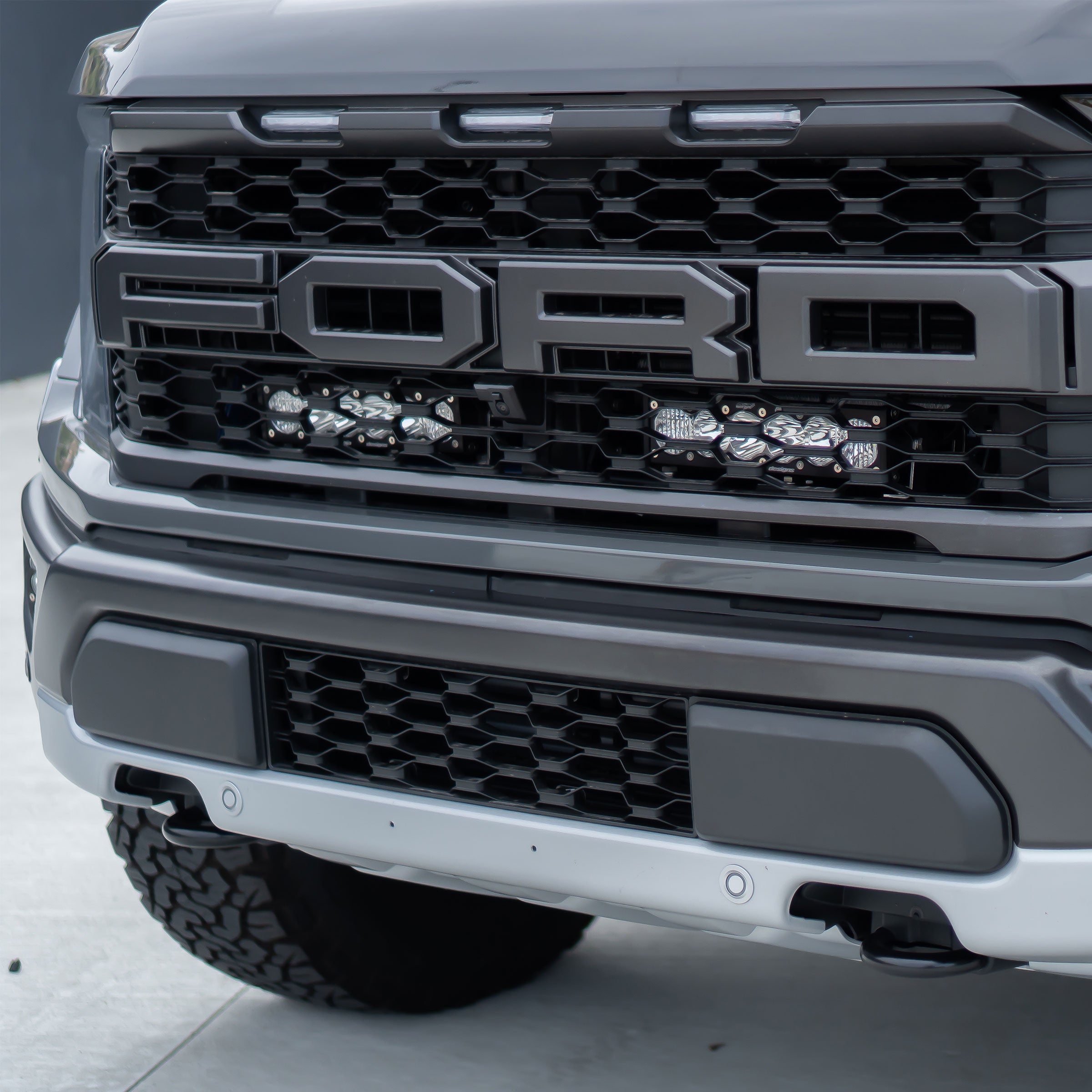 '21-22 Ford Raptor Baja Designs OnX6+ Light Bar Behind the Grille Kit display on Vehicle 